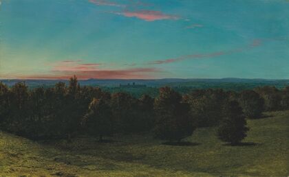 A castle in a forest at sunset