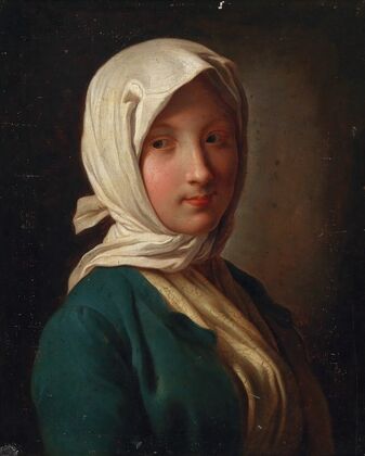 A girl in a blue jacket and white headscarf