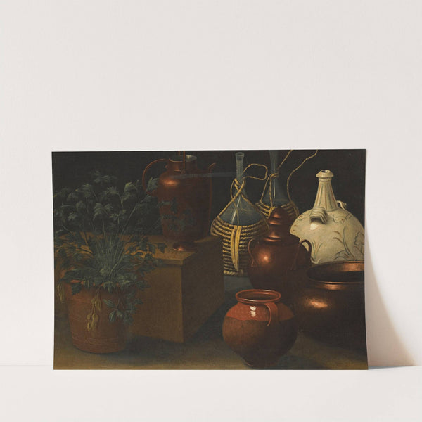 A Still Life With Two Wicker Covered Glass Bottles, A Jug, A Selection Of Other Pots And An Herbaceous Plant by Rodolfo Lodi