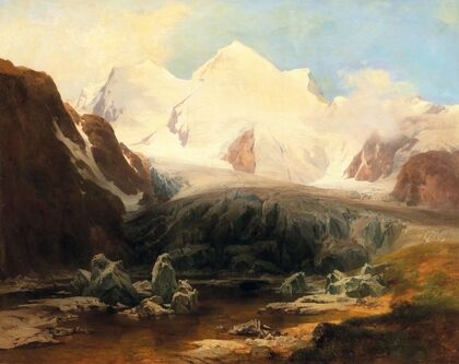 A View Of A Mountain Lake With Snow-Capped Mountains In The Background