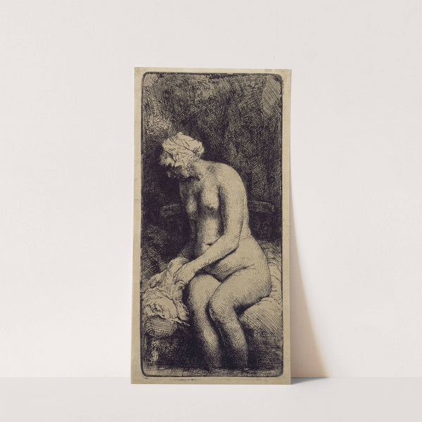 A Woman Bathing Her Feet at a Brook by Rembrandt van Rijn