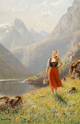 A young girl with a basket in the mountains