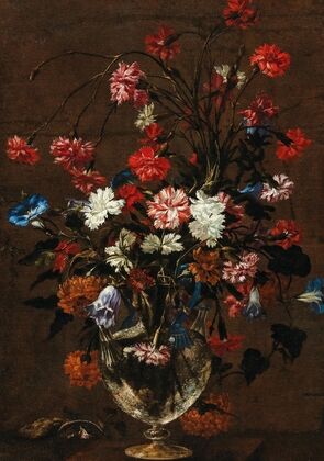 Carnations and other flowers in a glass vase