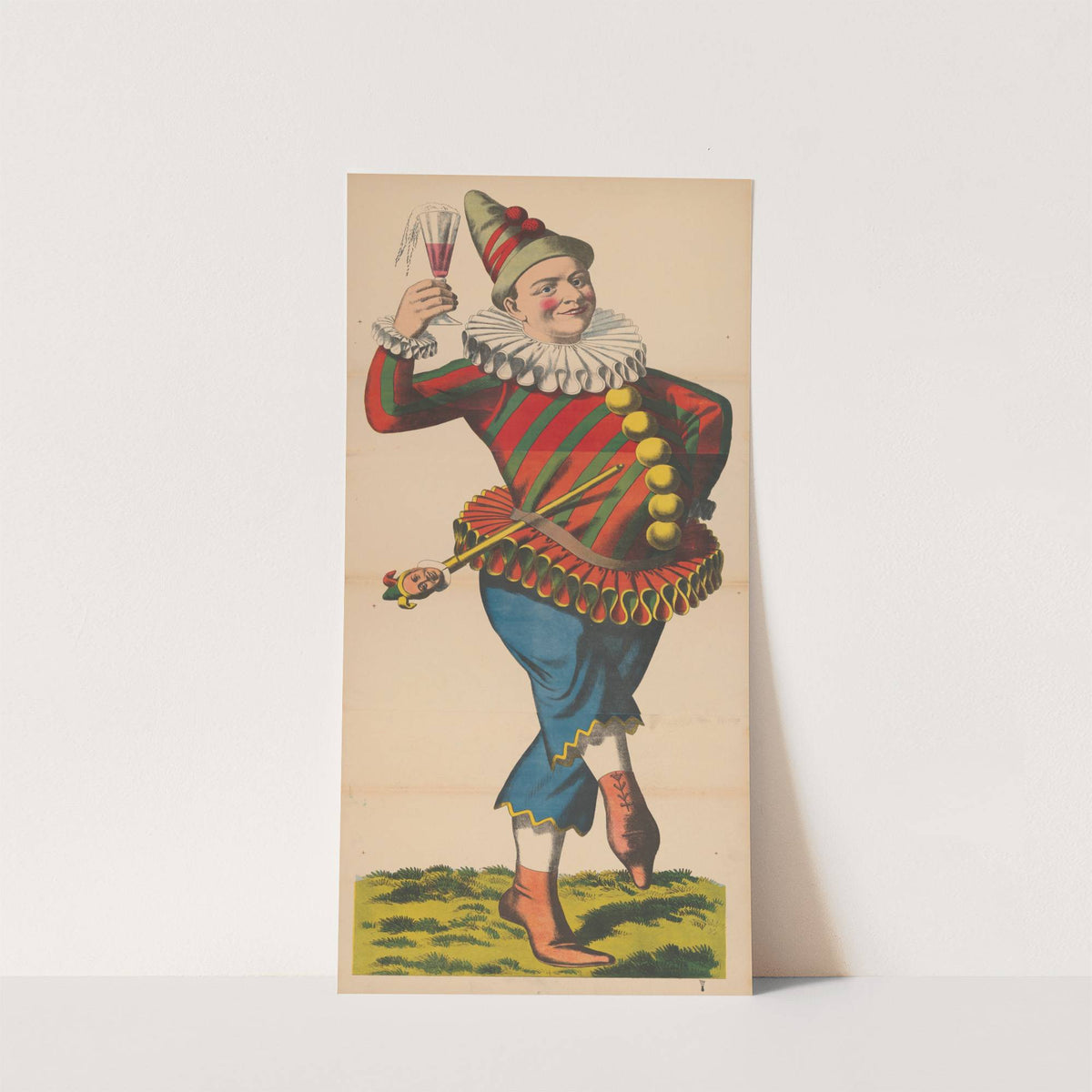 Carnival figure dressed as a jester with a glass of beer and a marotte by René Ackermann
