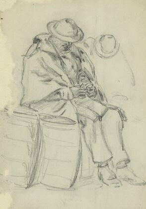 Figure wrapped in blanket sitting on a barrel and reading