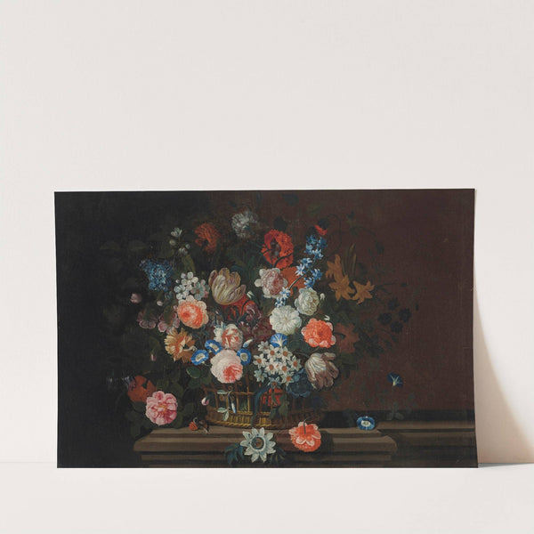 Flowers in a wicker basket on a stone ledge by Simon Hardimé