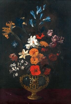 Flowers in an ornamental vase on a table