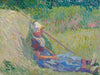 Girl resting against a haystack