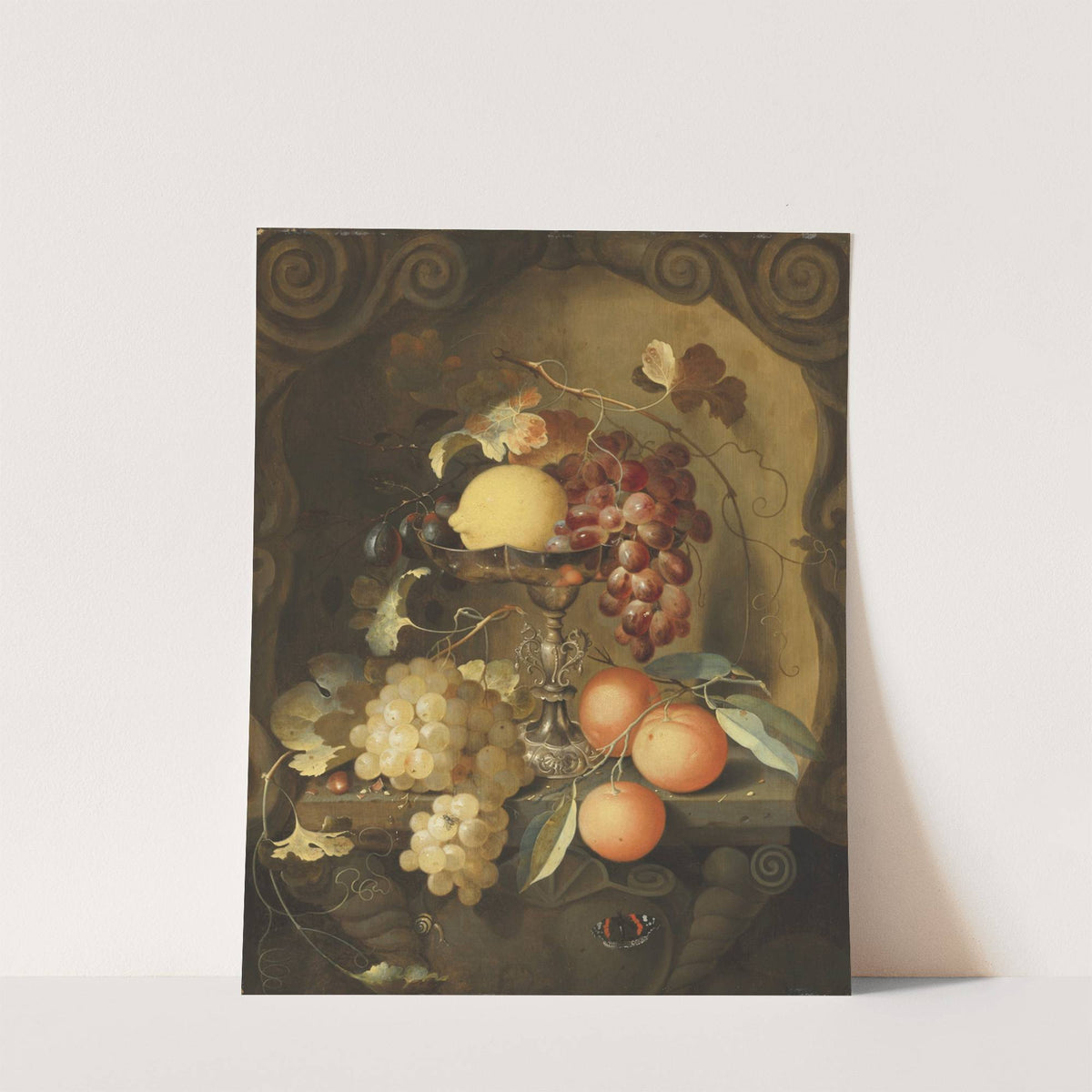 Grapes and a lemon on a tazza, with oranges on a ledge in a sculpted stone niche by Laurens Craen