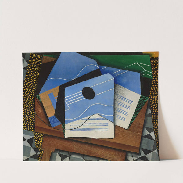 Guitar on a table by Juan Gris