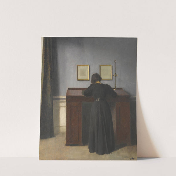 Ida Standing At A Desk by Vilhelm Hammershøi