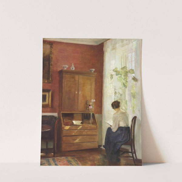 Interiør med læsende kvinde ved vinduet by Carl Holsøe