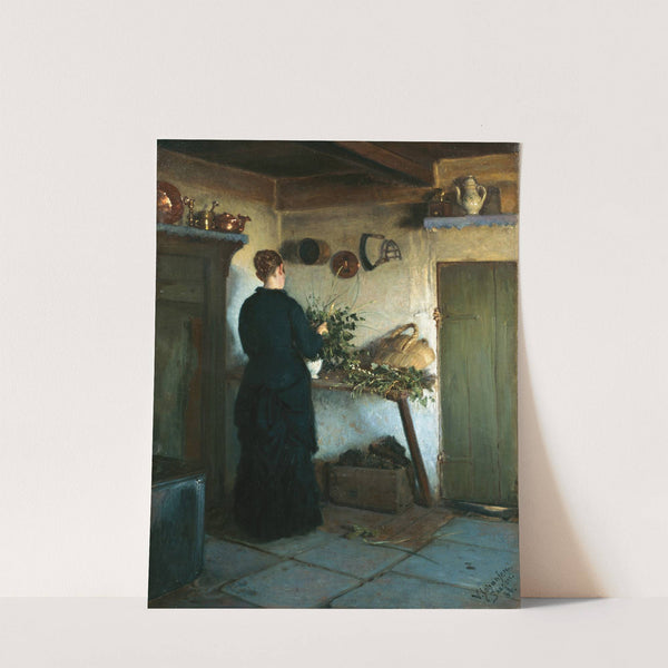 Kitchen interior. The artist's wife arranging flowers by Viggo Johansen