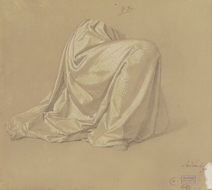 Kneeling garbed figure