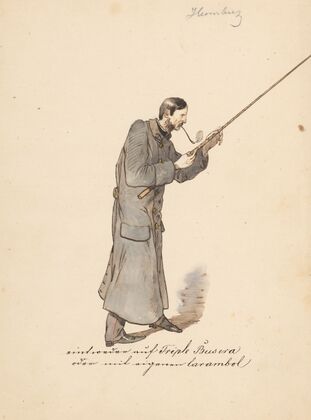 Man in a Long Military Coat with a Stick
