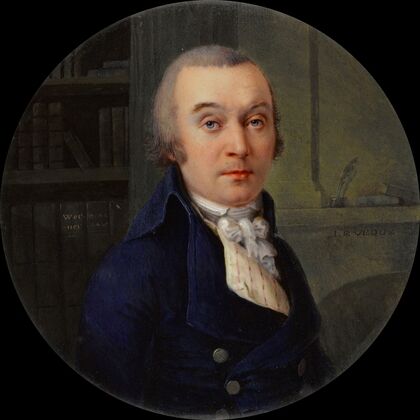 Portrait d’homme dans une bibliothèque