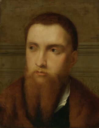 Portrait Of A Bearded Man, Head And Shoulders, In An Interior