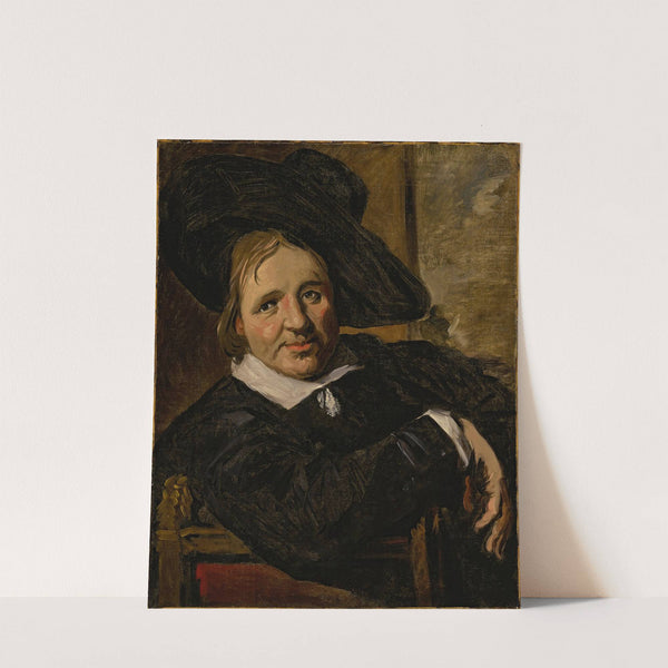 Portrait of a man, seated and wearing a hat by Follower of Frans Hals
