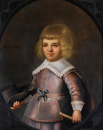Portrait Of A Young Boy Holding A Hat