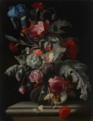 Roses, carnations, poppies, and hydrangea and an iris in glass vase with a snail and a butterfly on a stone ledge