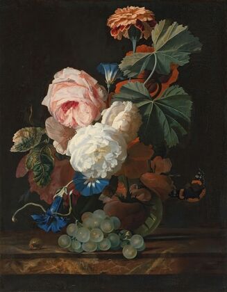 Roses, columbine, and poppies in a glass vase on a marble ledge with some grapes