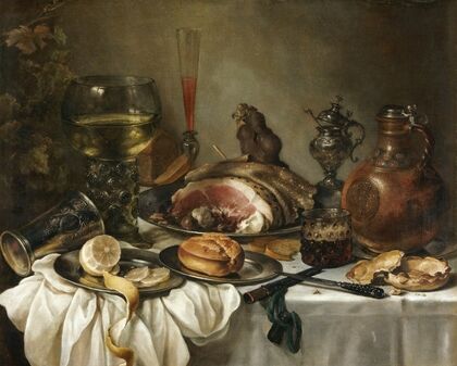 Still Life Of A Roemer, An Earthenware Jug, An Overturned Silver Beaker, A Ham And Other Objects Arranged Upon A Draped Table Top