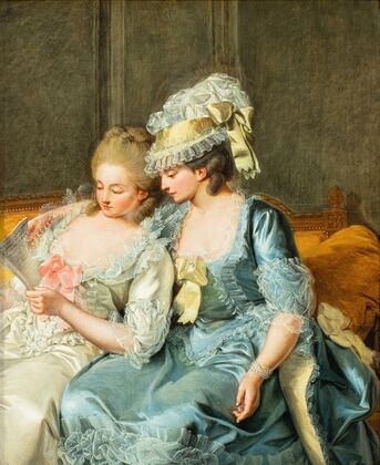 Two young women reading a Letter