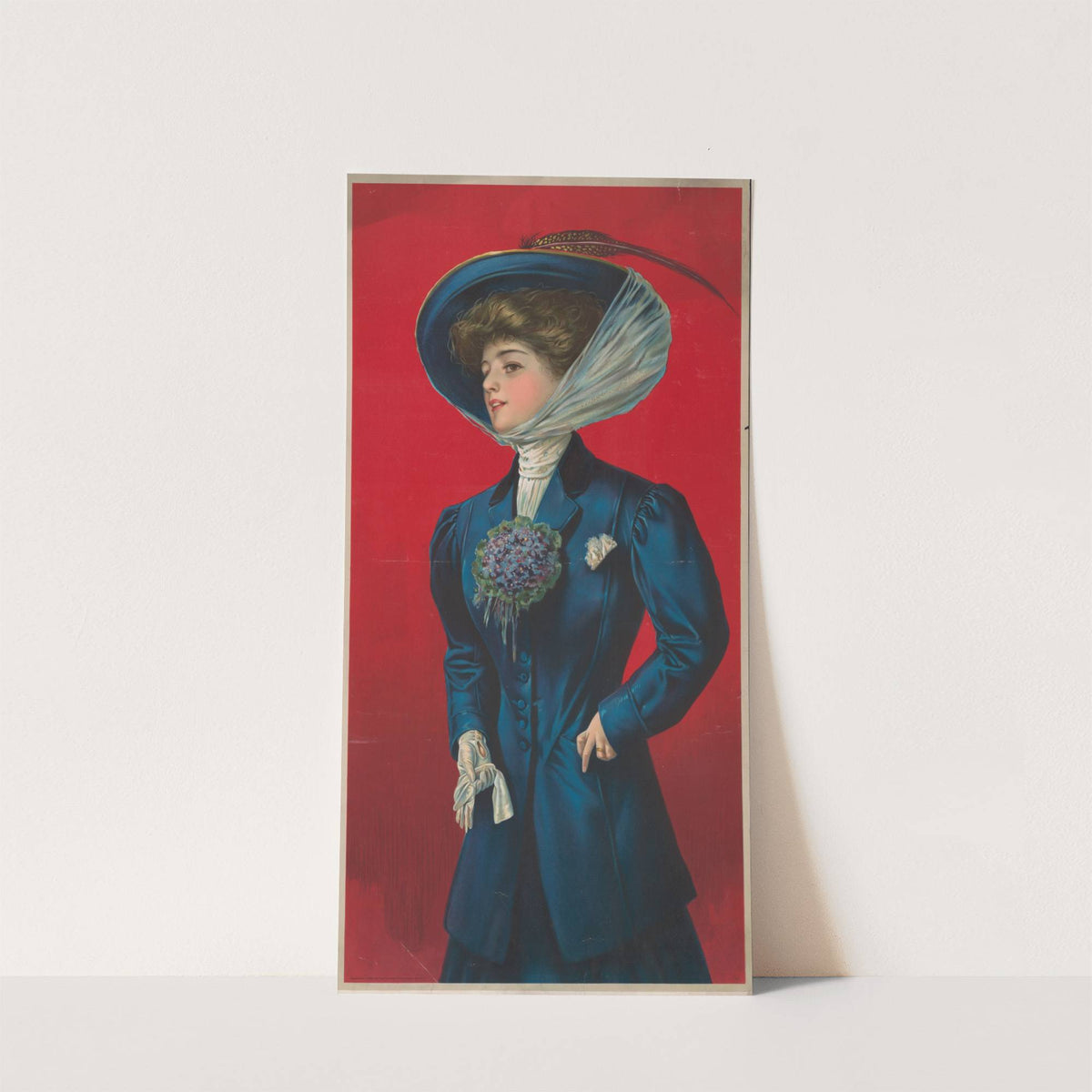 Woman in blue hat and coat with flower corsage on lapel (1908) by Sackett & Wilhelms Litho.