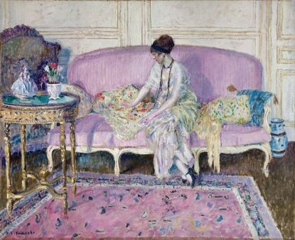 Woman Seated on Sofa in Interior