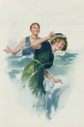 Young man splashing a young woman with water at the beach