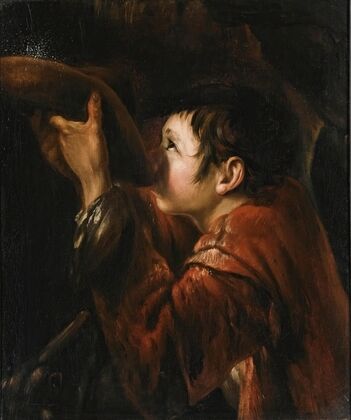 A Boy Using His Hat To Drink Water From A Fountain