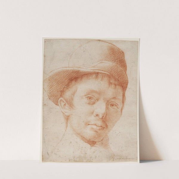 A boy wearing a workman&#039;s hat by Cristofano Allori
