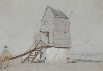 A Figure Beside A Windmill