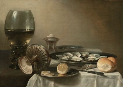 A large roemer, overturned tazza, salt cellar, partially sliced lemon, oysters, pepper, knife and bread on a partially draped table (1639)