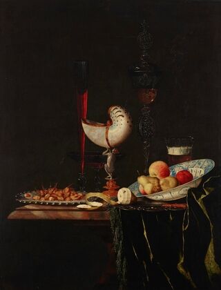 A nautilus cup, a flute, a façon-de-Venise and a wine and beer glass with nuts on a silver charger