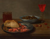 A plate with prawns and a roll, a bowl with olives, a façon de Venise, a glass of beer and almonds on a table