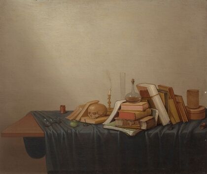 A Vanitas with books, a skull, a candle and various objects on a table