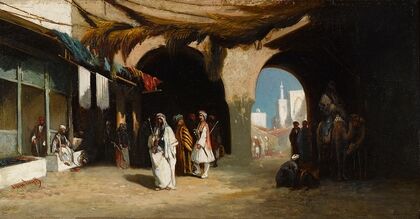 A view of a North African courtyard with market beyond