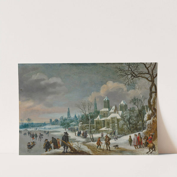 A winter townscape with figures skating on a frozen river by Daniel Van Heil