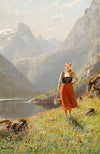 A young girl with a basket in the mountains