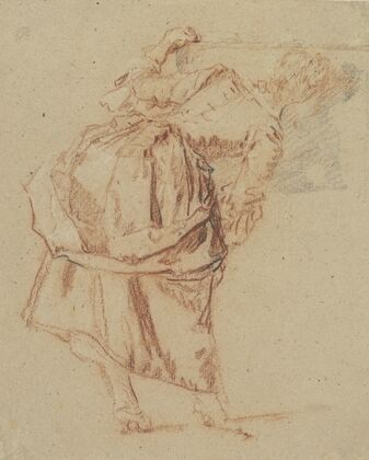 A Young Woman Looking in a Mirror