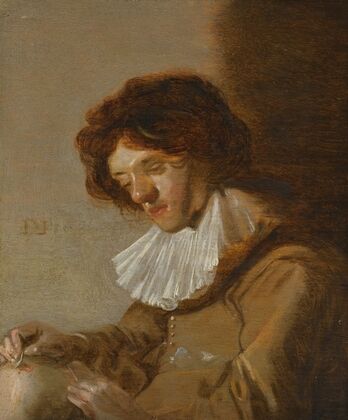 A Youth Holding A Flask