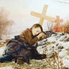 An orphan on his mother’s grave
