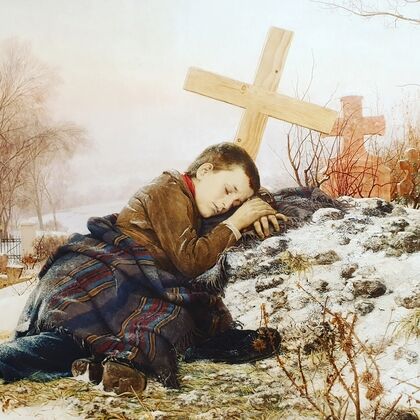 An orphan on his mother’s grave