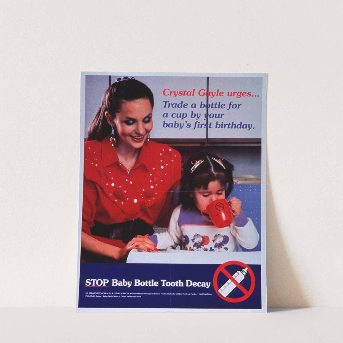 Crystal Gayle urges..trade a bottle for a cup by your baby’s first birthday (1988) by U.S.. Department of Health & Human Services