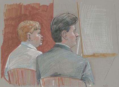 Defendant Bobby Wayne Woods with his lawyer during his trial for murder, kidnapping, and assault