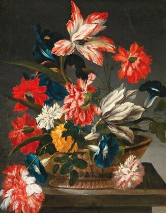 Flowers in a decorative vase on a stone ledge