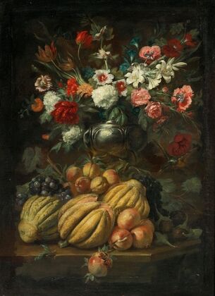 Flowers in a vase and fruit on a table