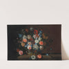 Flowers in a wicker basket on a stone ledge by Simon Hardimé