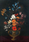 Flowers in an ornamental vase on a table